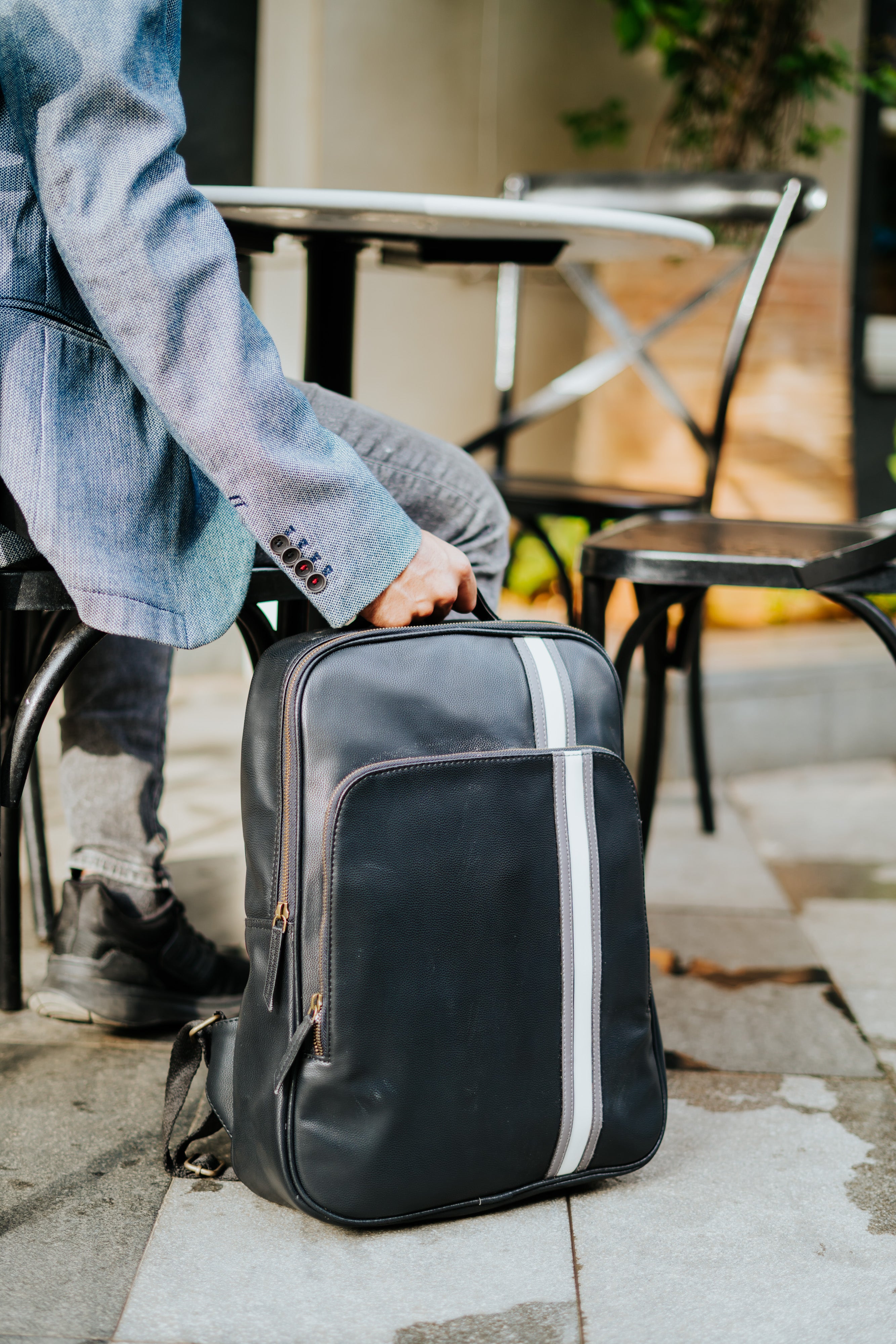 Man with laptop bag best sale